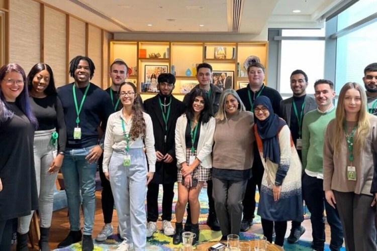 A group of Salesforce employees in Dublin standing and posing together.
