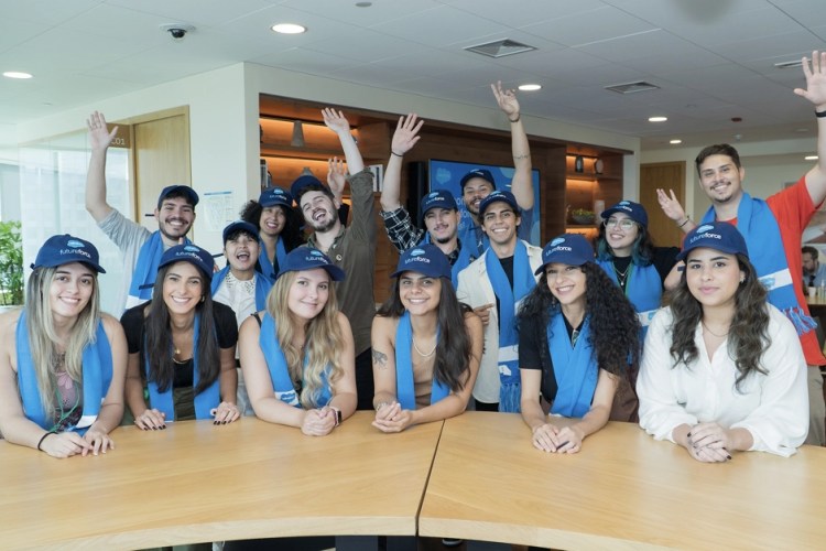 A group of Salesforce employees from Sao Paulo Brazil are posing together, wearing caps with the Salesforce logo on them.