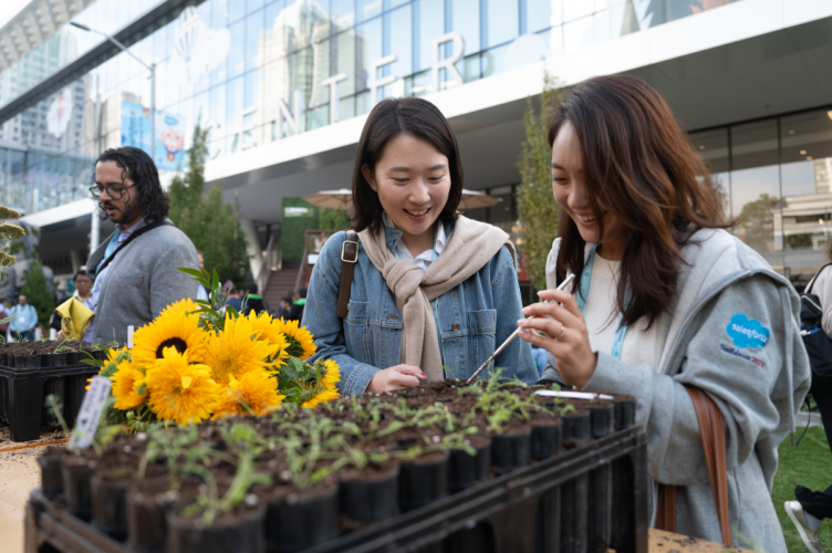 Two women at Dreamforce event plant seeds
