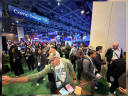 A crowd of attendees at Dreamforce. The Camp Design sign hangs from the rafters in the background.