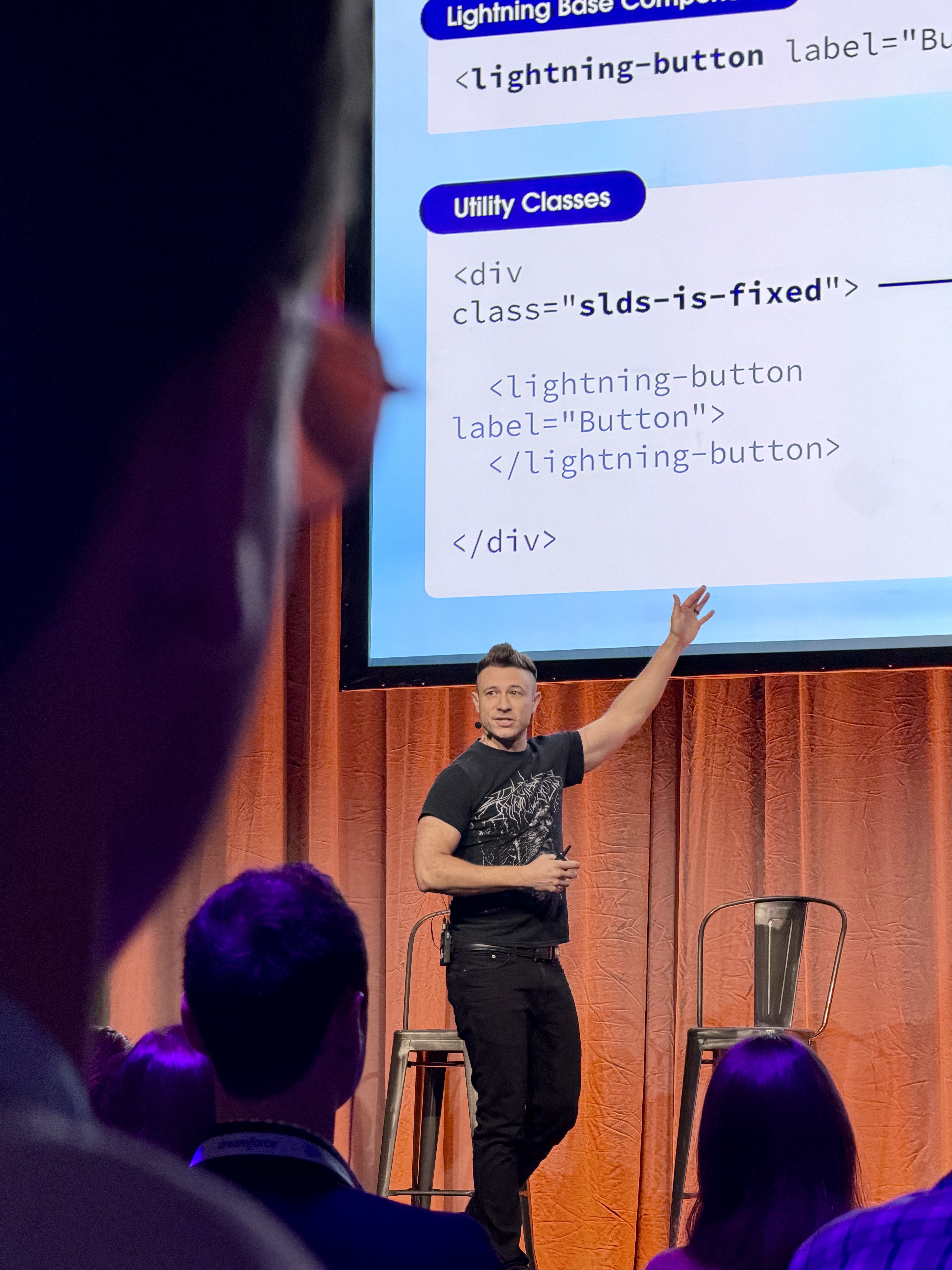 Cliff Seal on stage at Dreamforce 2025, framed by the side of an audience member's face.