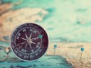 Compass and map laid out to show journey mapping for small businesses.