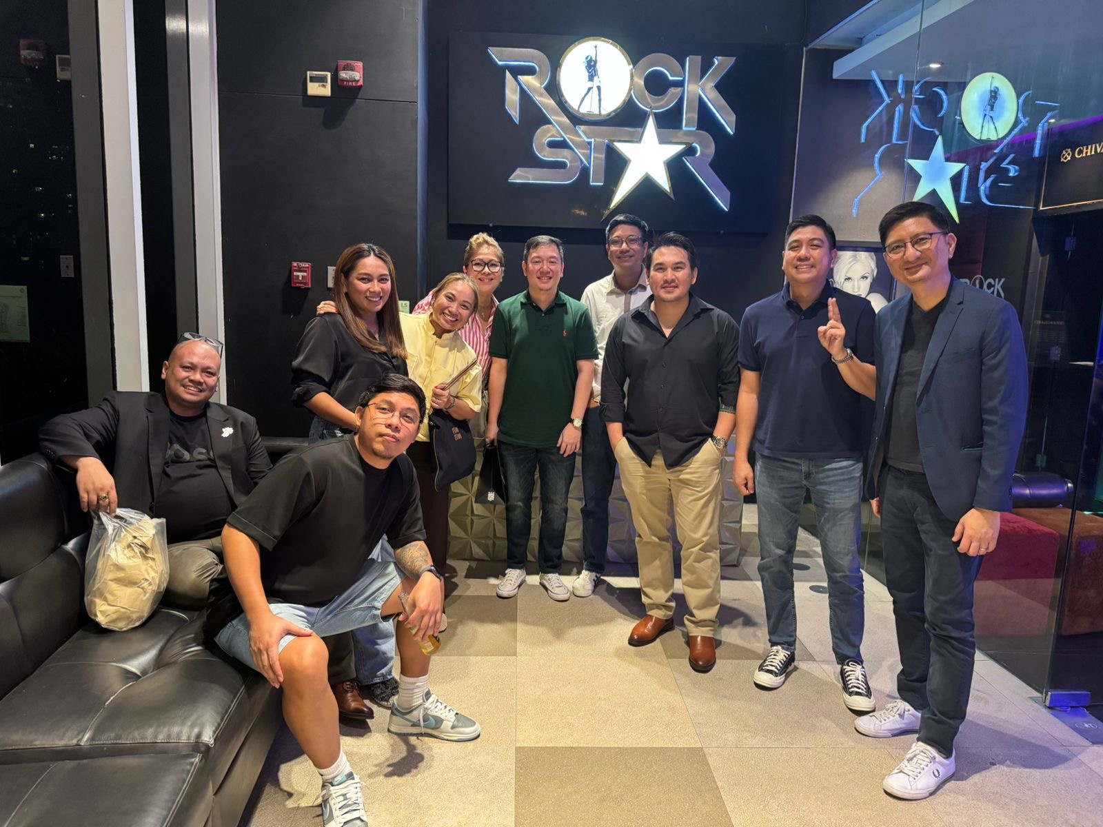 Group of people posing together for a photo at a team outing