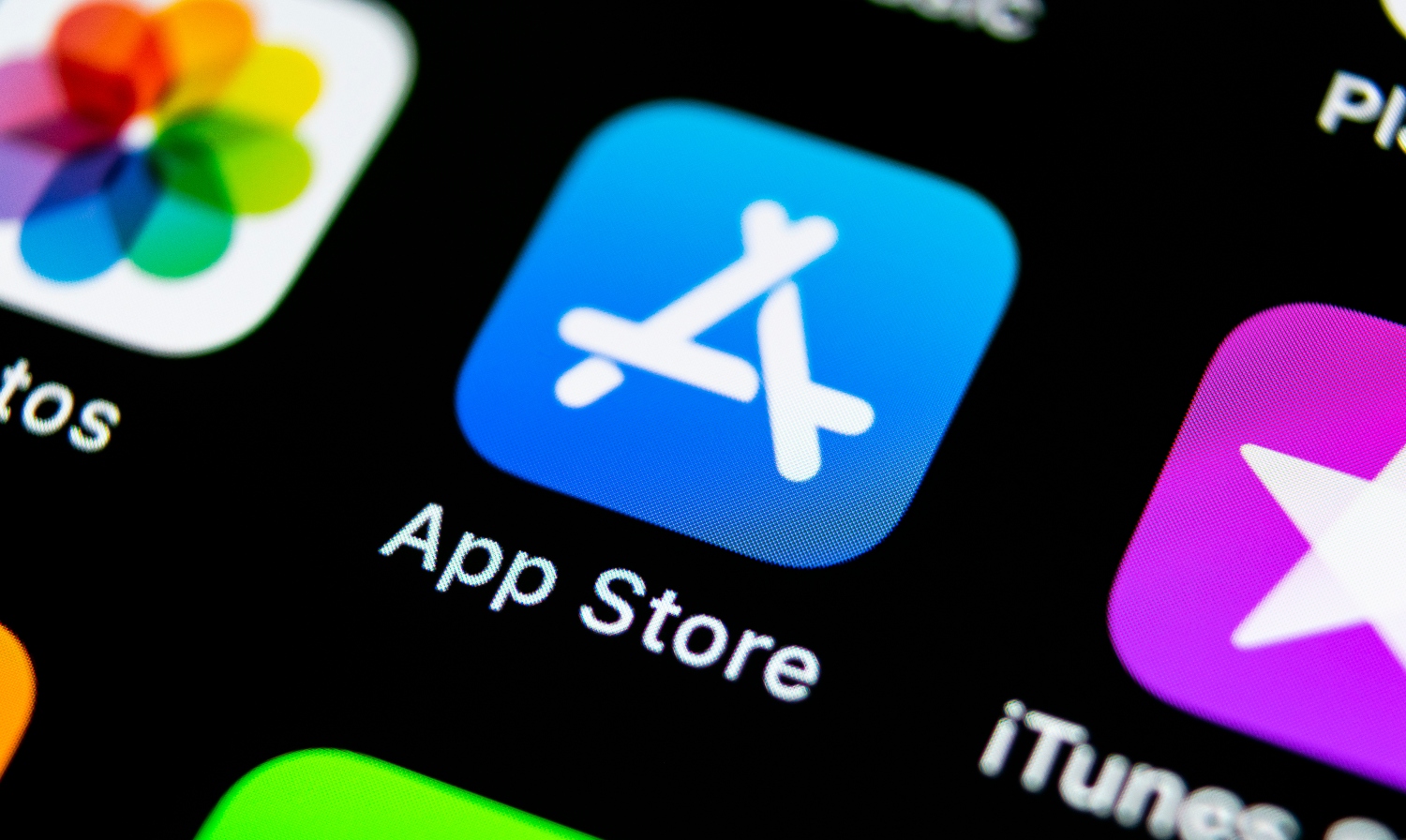 Apple store application icon on Apple smartphone screen close-up showcasing app store optimization.