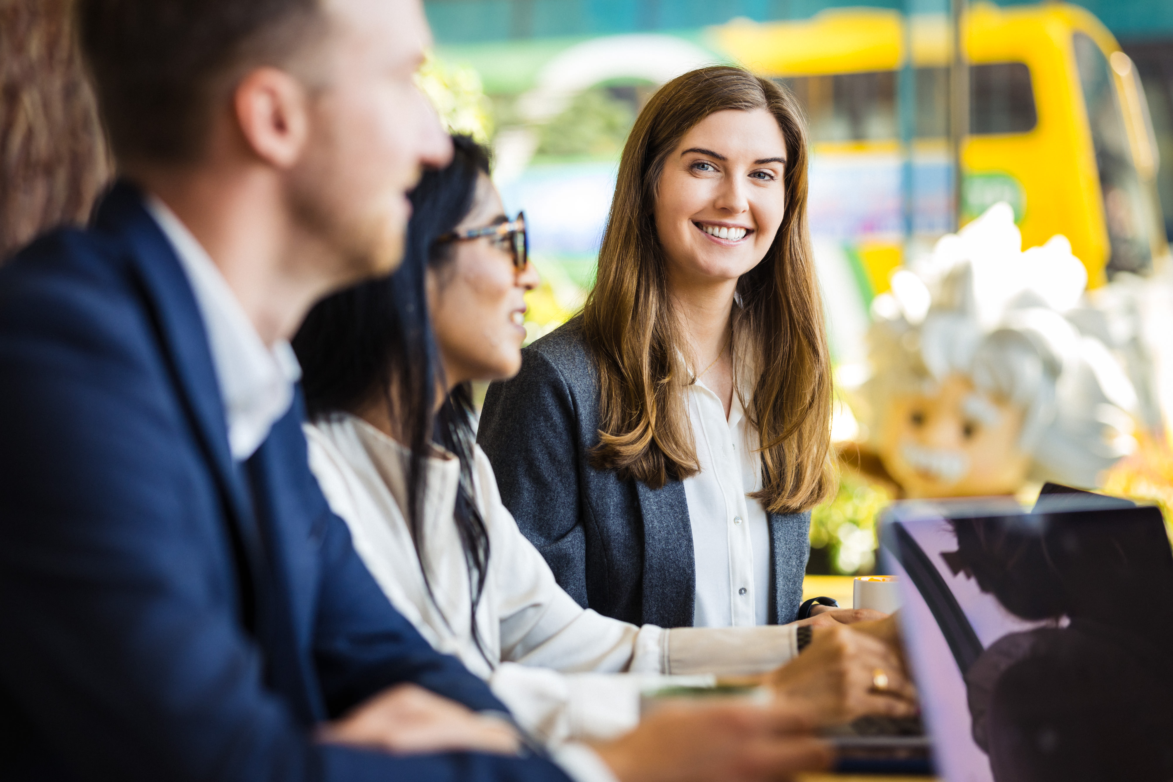 group of three employees collaborating
