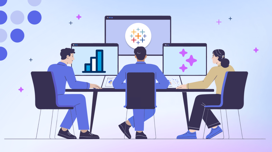 Laptop computers displaying logo of Tableau Software for a team at a desk.