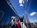 group of employees cheer outside of a salesforce office
