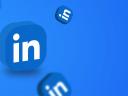 A LinkedIn icon in a square on a blue background.