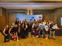 group of employees pose at a Salesforce event