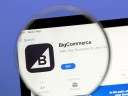 BigCommerce app on an ipad emphasized with a magnifying glass.