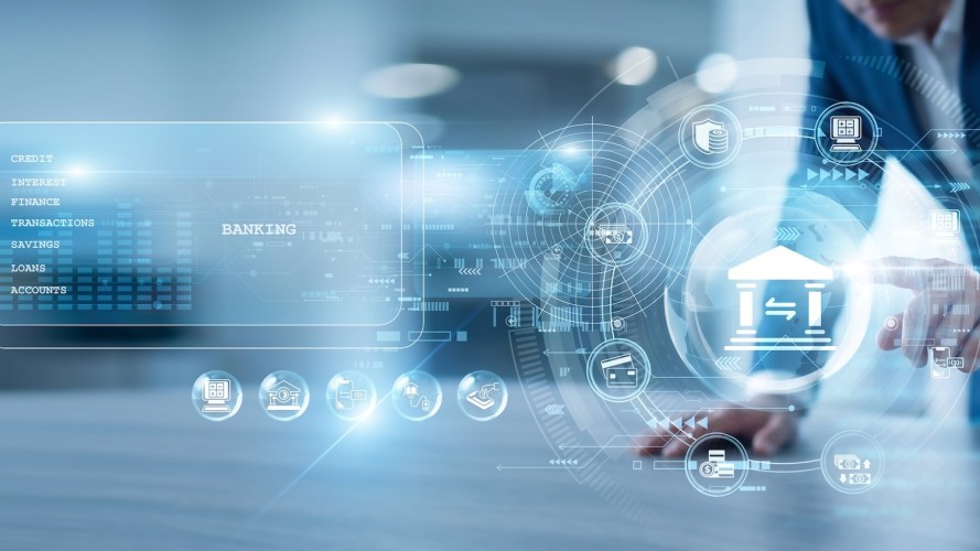 touching a glowing, futuristic digital interface that displays a central bank building icon surrounded by financial data and banking categories.