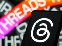 Threads icon and and decal on a mobile phone.