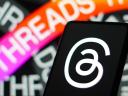 Threads icon and and decal on a mobile phone.
