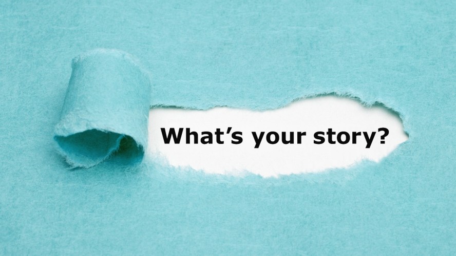 A blue paper ripped with white underneath, showing the font “What’s your story?” typed out.