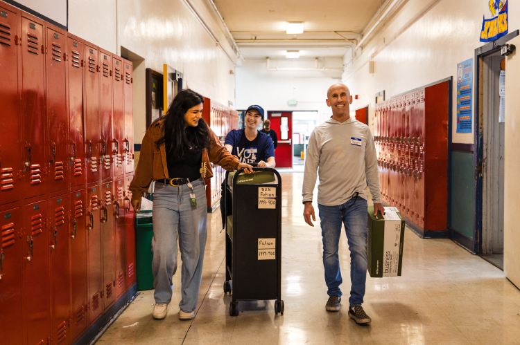 Salesforce volunteers smile for a photo during a Bay Area school volunteer activity.