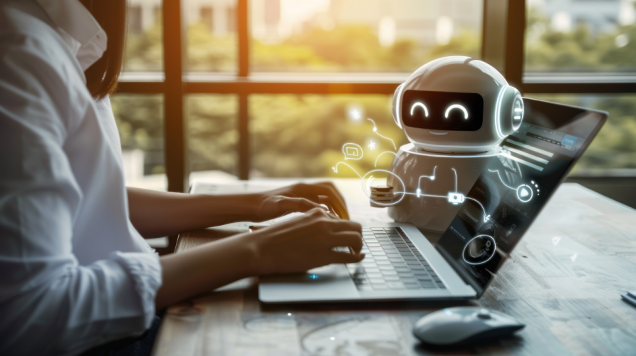 Person on laptop while AI agent is on screen.