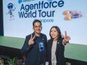 A man and a women in front of the Agentforce World Tour Singapore event stage.