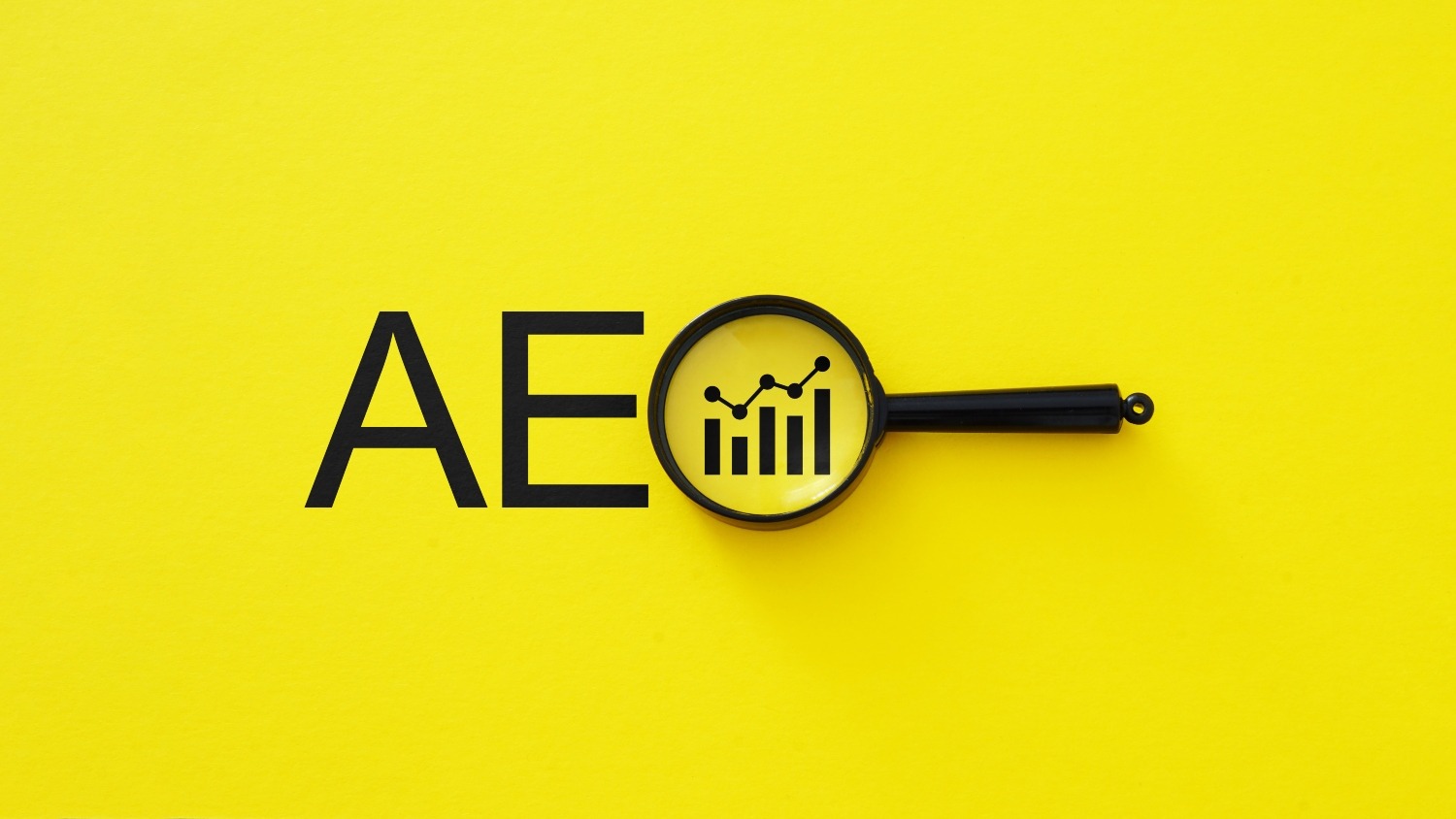 Illustration of AEO font on yellow background with a magnifying glass.