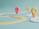 An illustration of location icons on a path, mapping business processes metaphorically, on a light blue background.