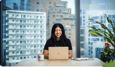 A woman on sitting at a computer