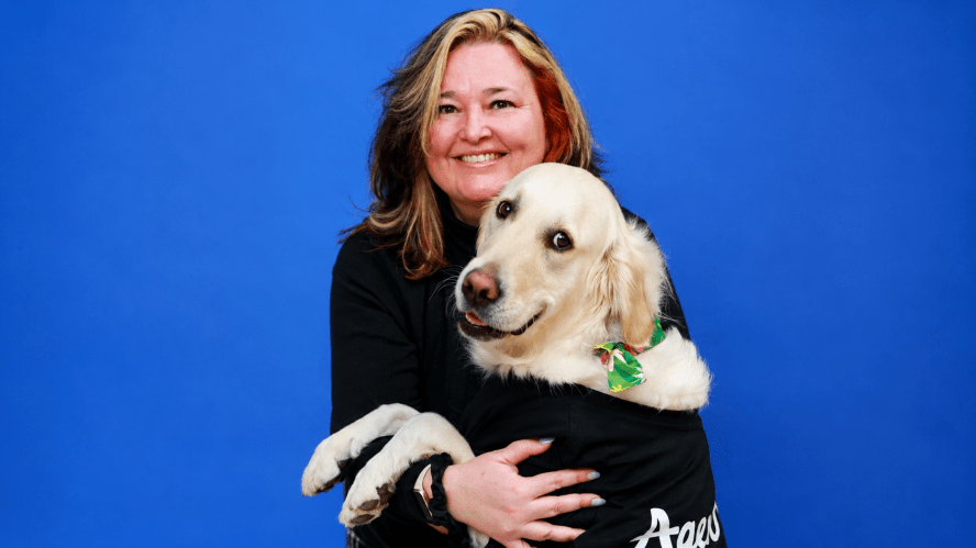 A woman and her dog smiling for camera