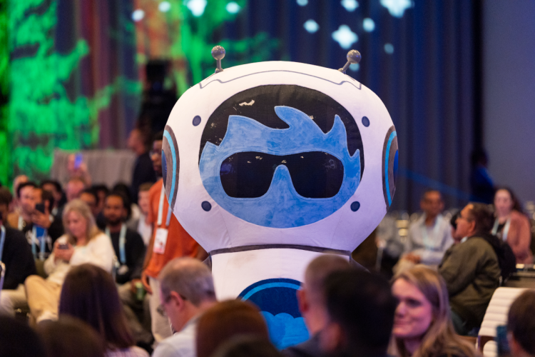 Agent Astro Character interacting with session attendees.
