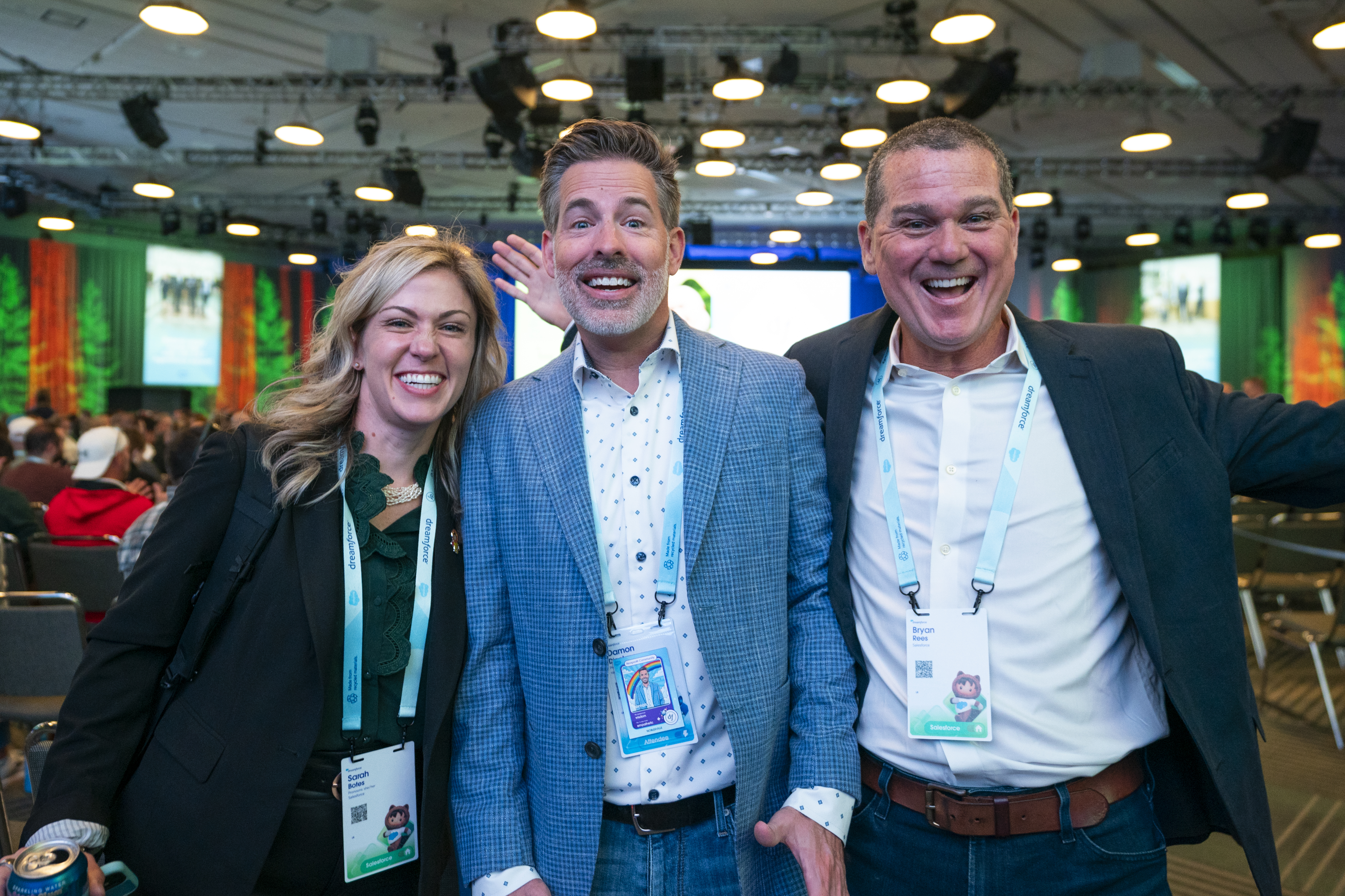 Dreamforce attendees smiling into camera after a session.