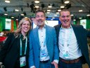 Dreamforce attendees smiling into camera after a session.
