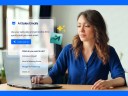 WOman at desk with sales AI agent in business setting with icons on screen.