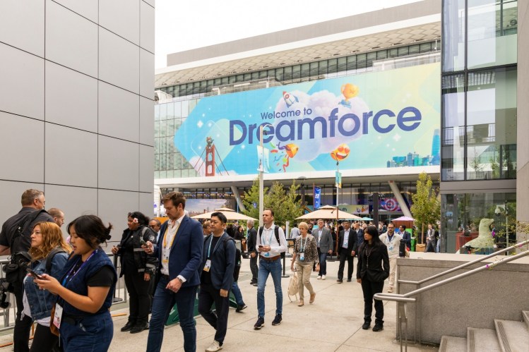 Dreamforce sign during conference outside with people walking in California.