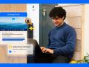 A marketer using a marketing agent with promotional messaging icons on a laptop with a blue border.