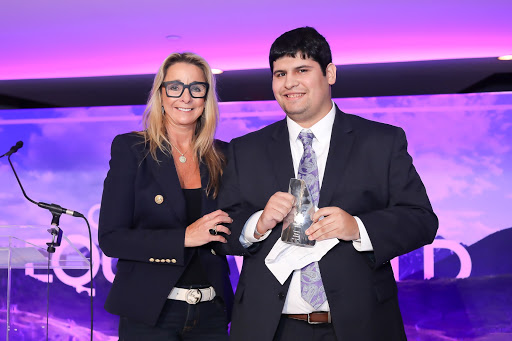 Julie Miller, Deloitte Consulting LLP Principal presenting the award to Sal Carrera, Associate DAS Analyst at Deloitte and Salesforce Equality Award honoree
