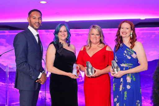Tony Prophet, Chief Equality Officer at Salesforce awarding RAD Women (from left to right) Kieren Jameson, Angela Mahoney, and Melissa Hansen