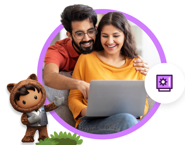 A couple engages with a laptop on a couch, accompanied by Astro, highlighting a unique and playful domestic moment.