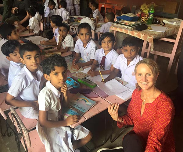 Nancy with kids in a Sri Lanka classroom