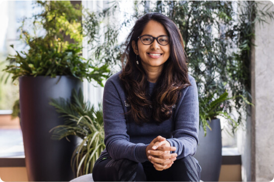 Soundarya Balasubramani seated, smiling at the camera