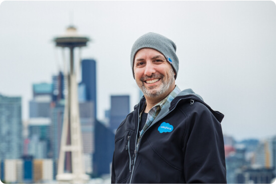 Scott Lief smiling at the camera with seattle in the backdrop