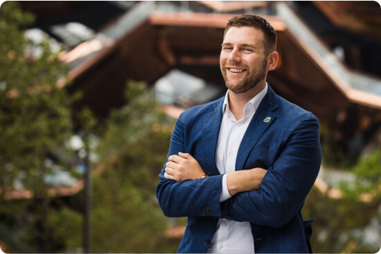 Connor Chadwick smiling with arms crossed