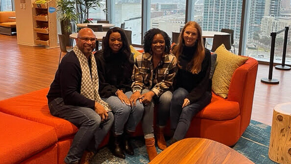 Arielle with her manager and coworkers in the Dallas Salesforce office