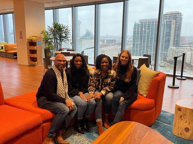Arielle with her manager and coworkers in the Dallas Salesforce office