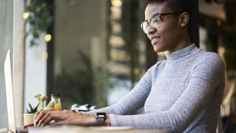 Woman typing on keyboard