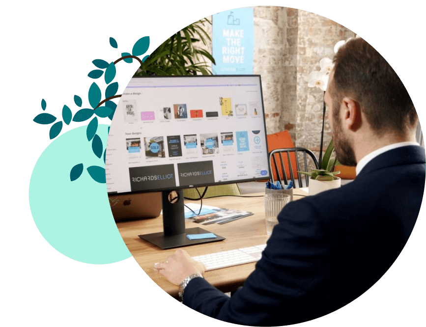 A person works at the computer using Canva