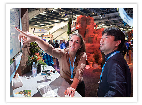 Toronto Skyline with Einstein character holding a sign stating Booth #8
