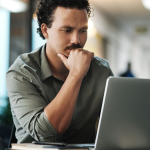 A sales person sits frustrated at the computer: Mental health in sales