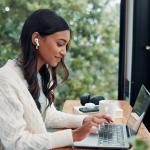 Professional working remotely on laptop using digital business productivity tools