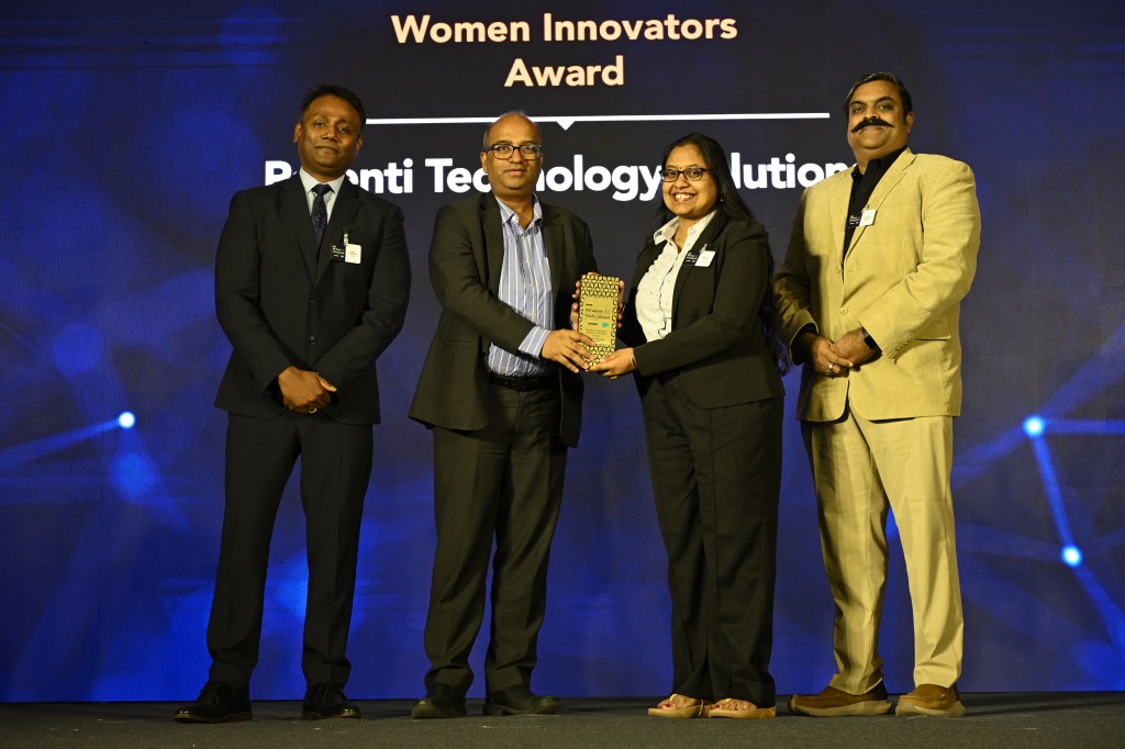 Amrutha Moorthy collecting Tech4Good Award