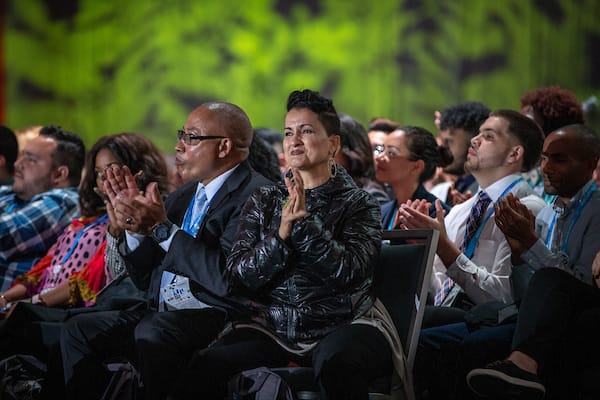 A diverse crowd claps for speakers at Dreamforce