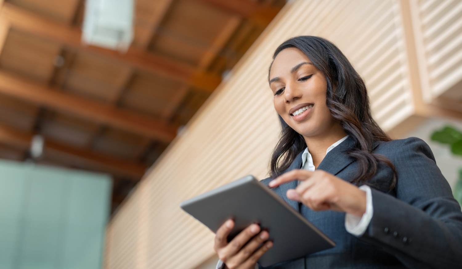 A businesswoman using government technology on a digital device.