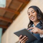 A businesswoman using government technology on a digital device.