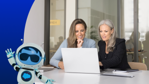 Two women sit in front of a laptop reading about The Zero Copy Imperative: Data’s Role in Enabling Agentic AI